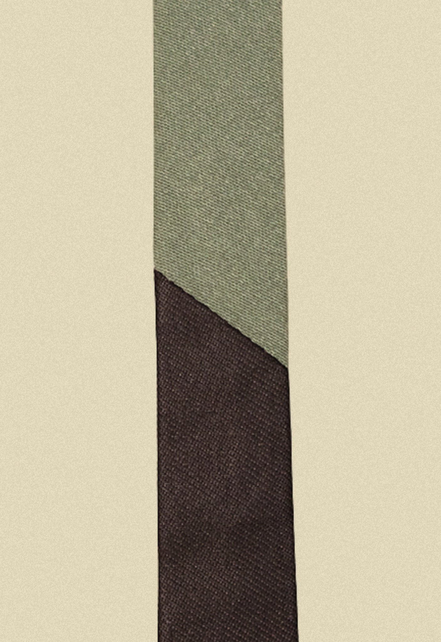 Repurposed coated black and army sateen tie on a beige background